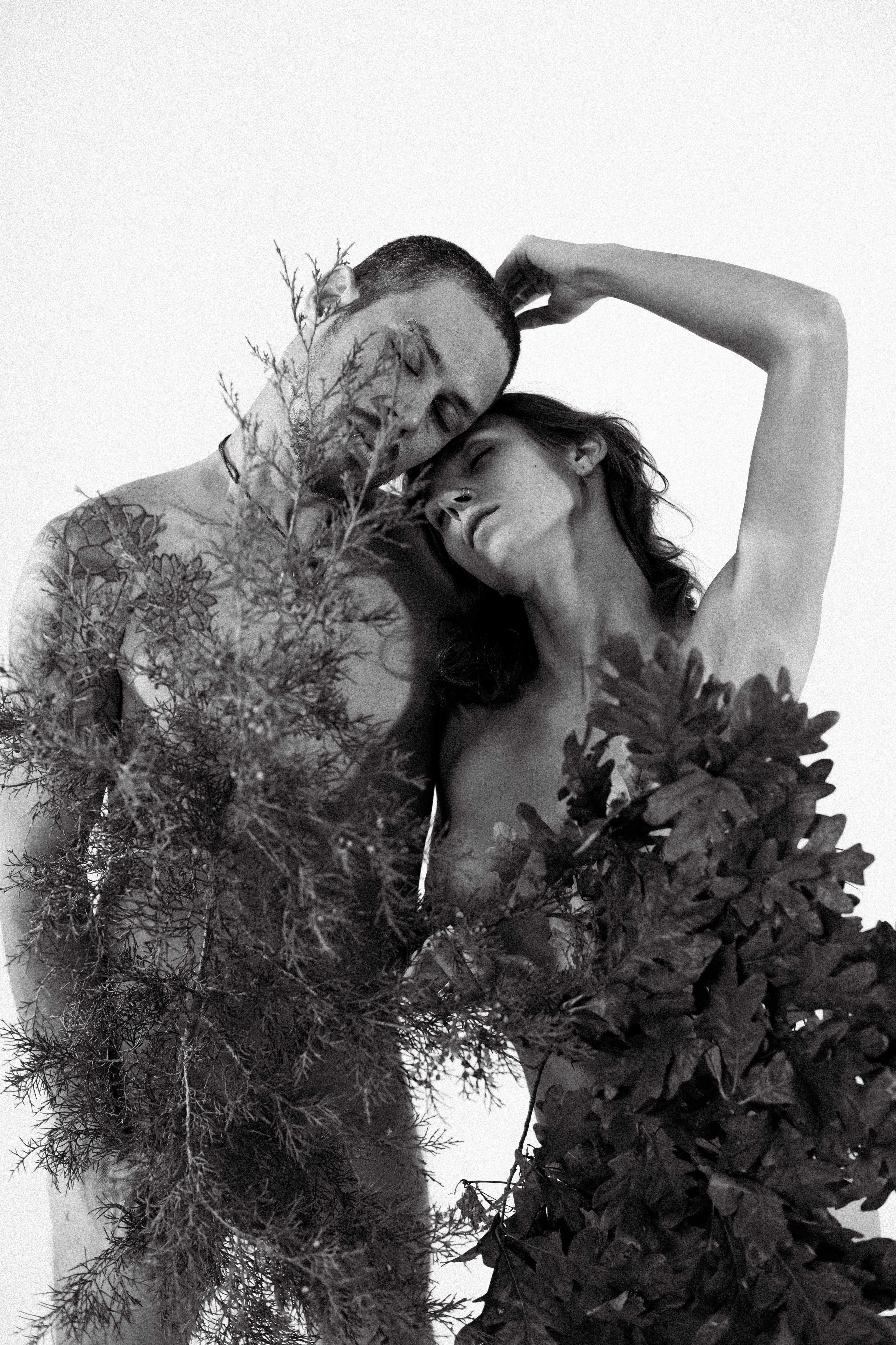Intimate couple portrait surrounded by fall foliage and natural beauty