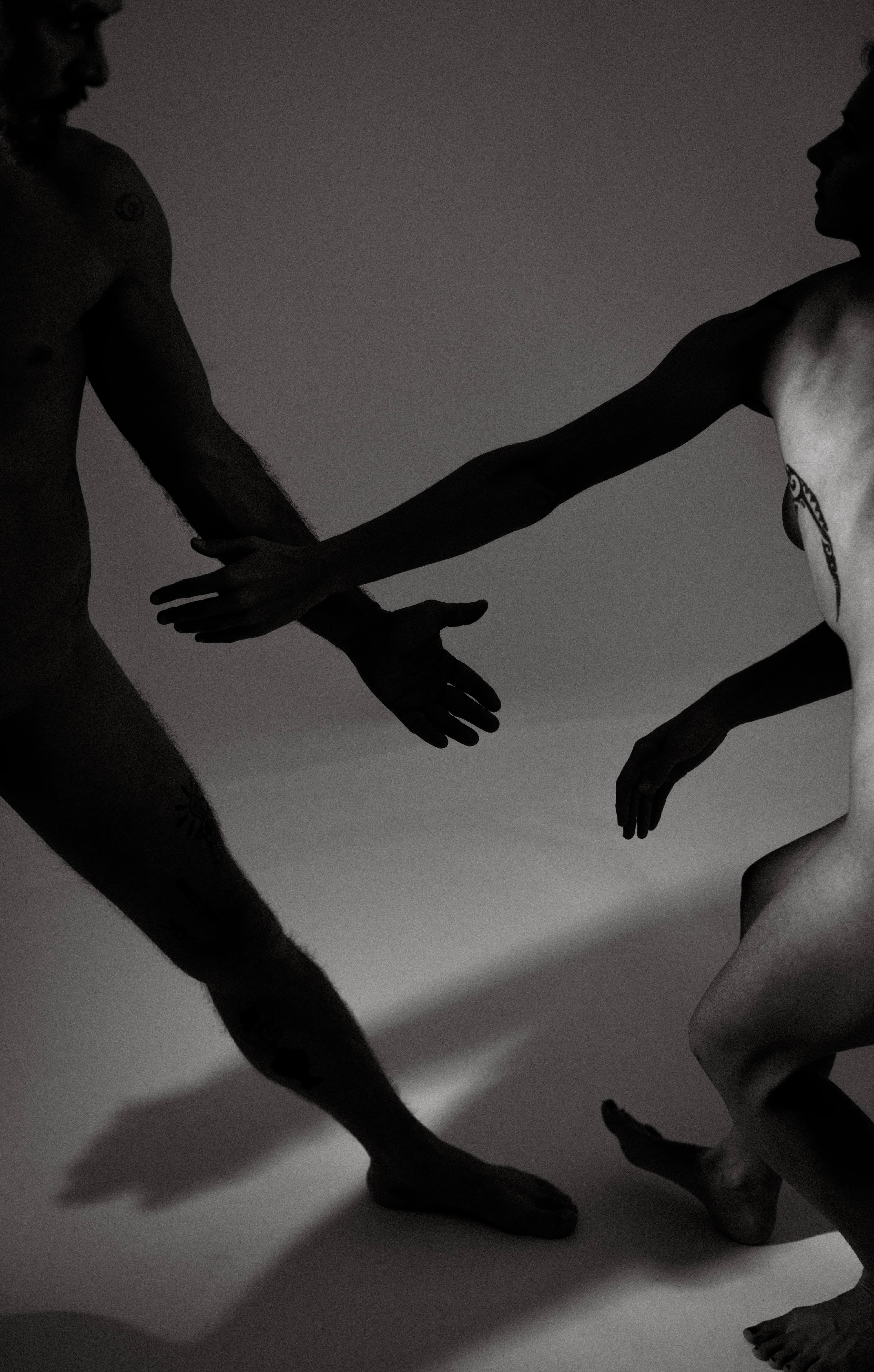 Couple silhouette in black and white against scenic backdrop